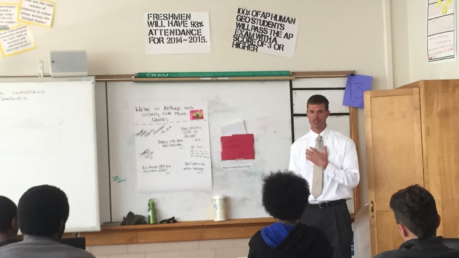 Students in an A.P. Human Geography class at Manual High School ask Kurt Dennis questions about his interest in replicating McAuliffe International Middle School, where he is principal, in the Manual building.