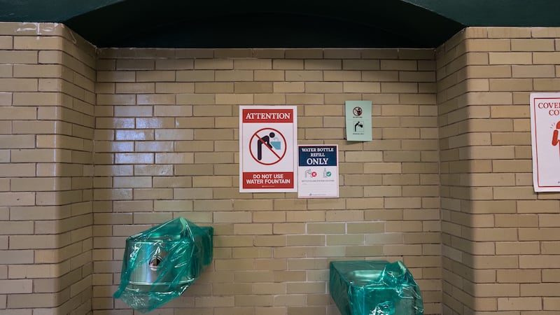 Water fountains are seen covered at Senn High School on the first week back to classrooms for students on April 23, 2021.