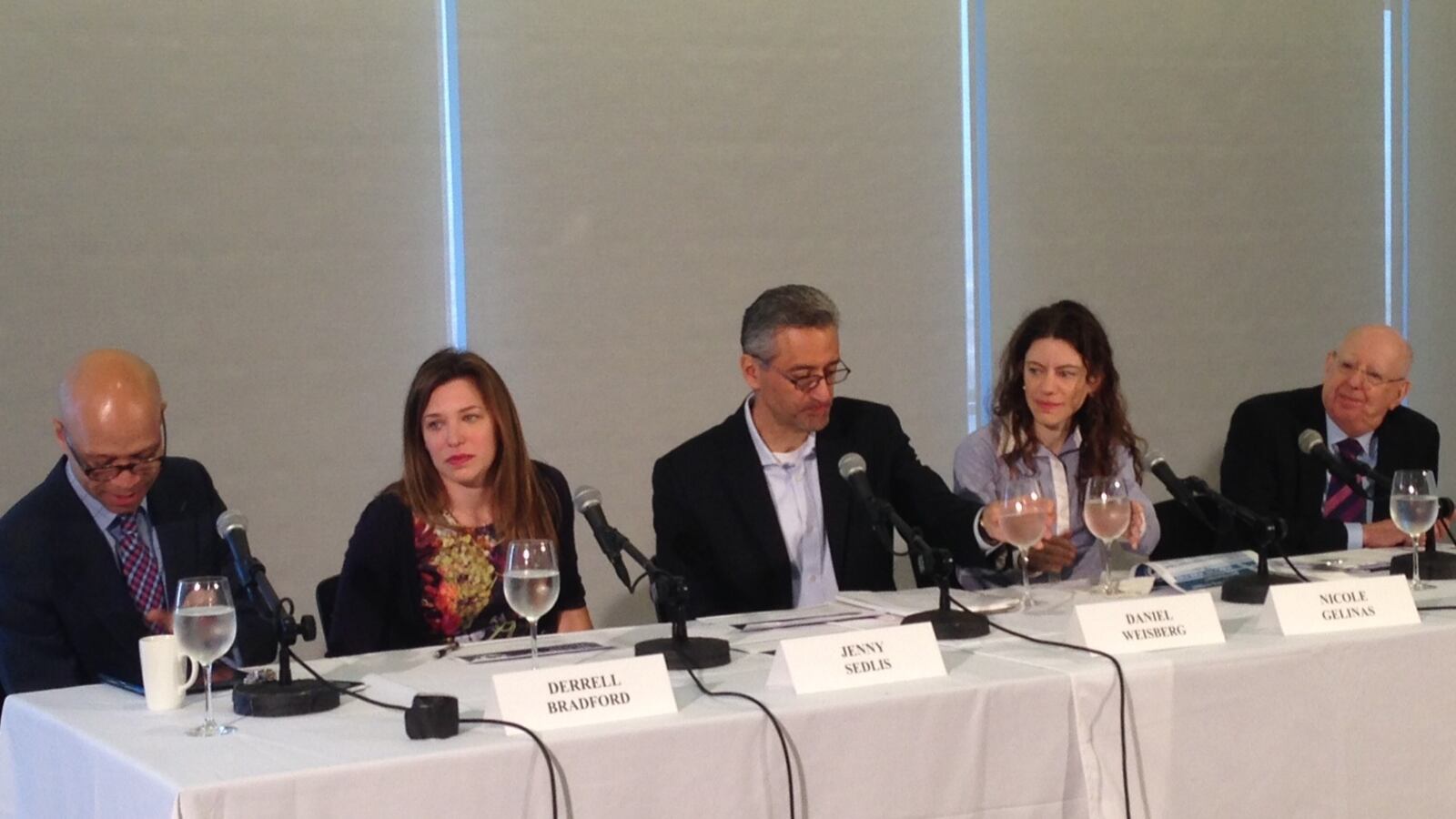 Panelists at a discussion on the teachers contract.