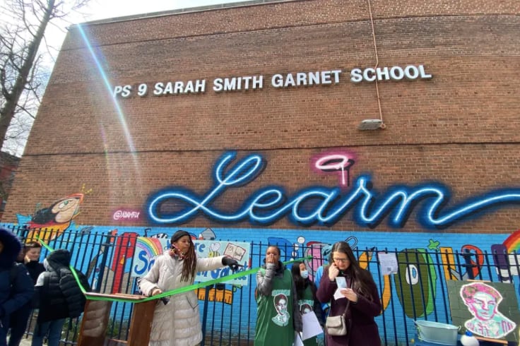 The P.S. 9 community in Prospect Heights cuts the ribbon on a new school sign with Sarah Smith Garnet’s name.