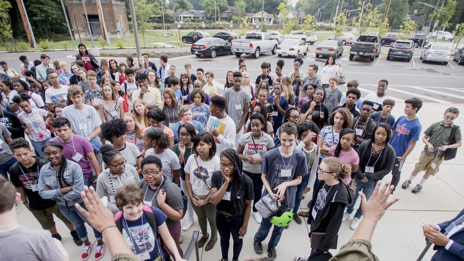 Principal Chandra Sledge-Mathias speaks to Crosstown High School's inaugural ninth grade class outside the building on the first day of school.