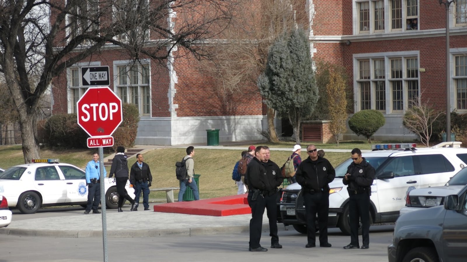 Denver police at East High School supervise a protest led by South students.