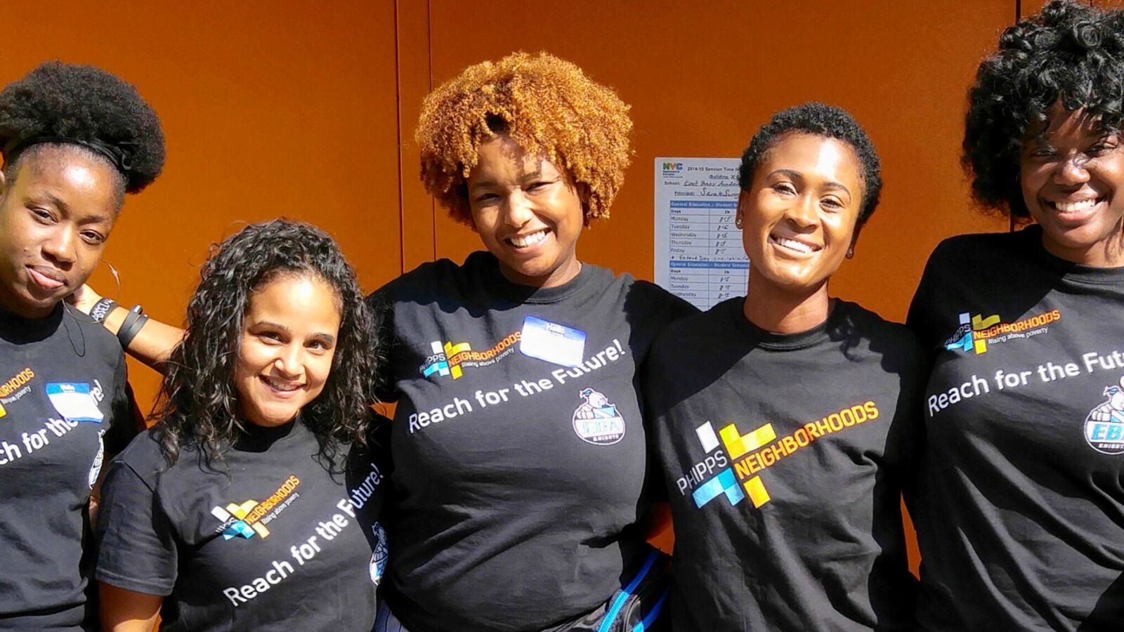 Perquida Payne (center) with colleagues. Payne is the community school director at the East Bronx Academy of the Future.
