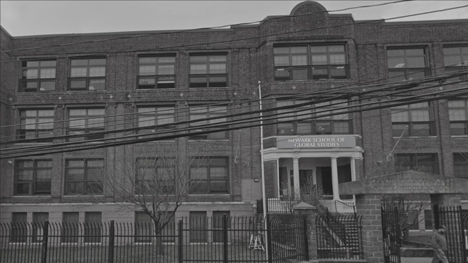 A black and white photo of a school building.