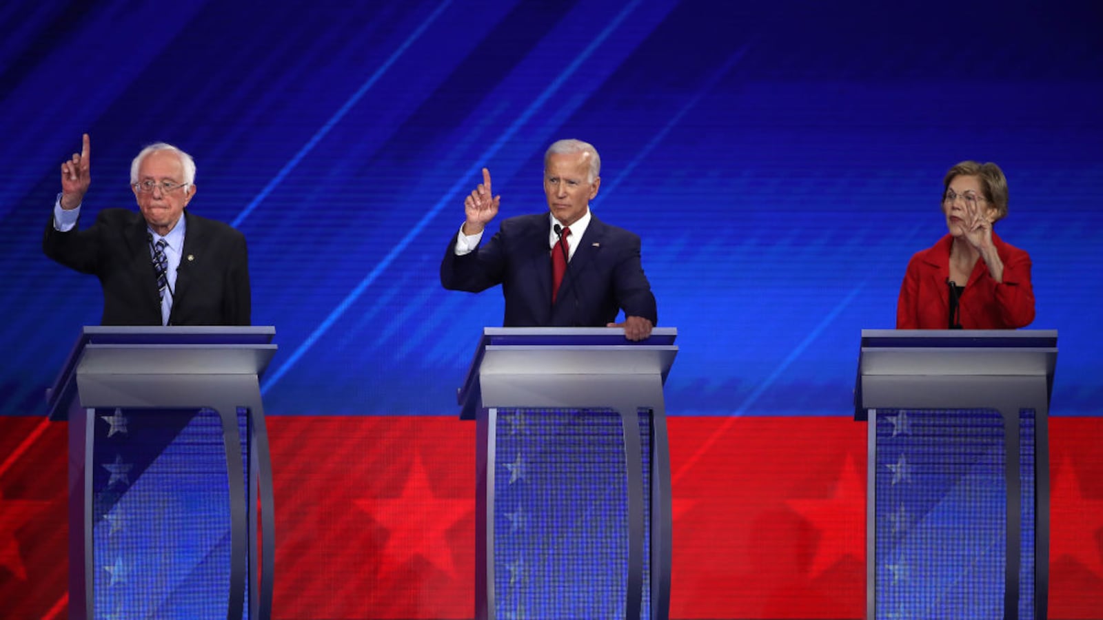 HOUSTON, TEXAS - SEPTEMBER 12: Democratic presidential candidates Sen. Bernie Sanders (I-VT), former Vice President Joe Biden, and Sen. Elizabeth Warren (D-MA) raise their hands during the Democratic Presidential Debate at Texas Southern University's Health and PE Center on September 12, 2019 in Houston, Texas.