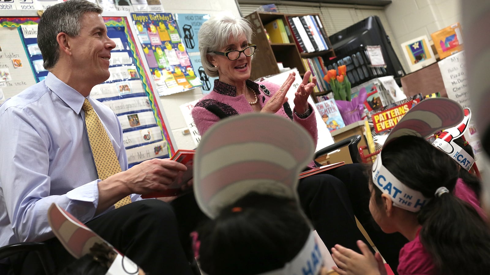 Education Secretary Arne Duncan and HHS Secretary Kathleen Sebelius read to students enrolled in a Head Start program at Rolling Terrace Elementary School March 1, 2013 in Takoma Park, Maryland. (Photo by Win McNamee/Getty Images)