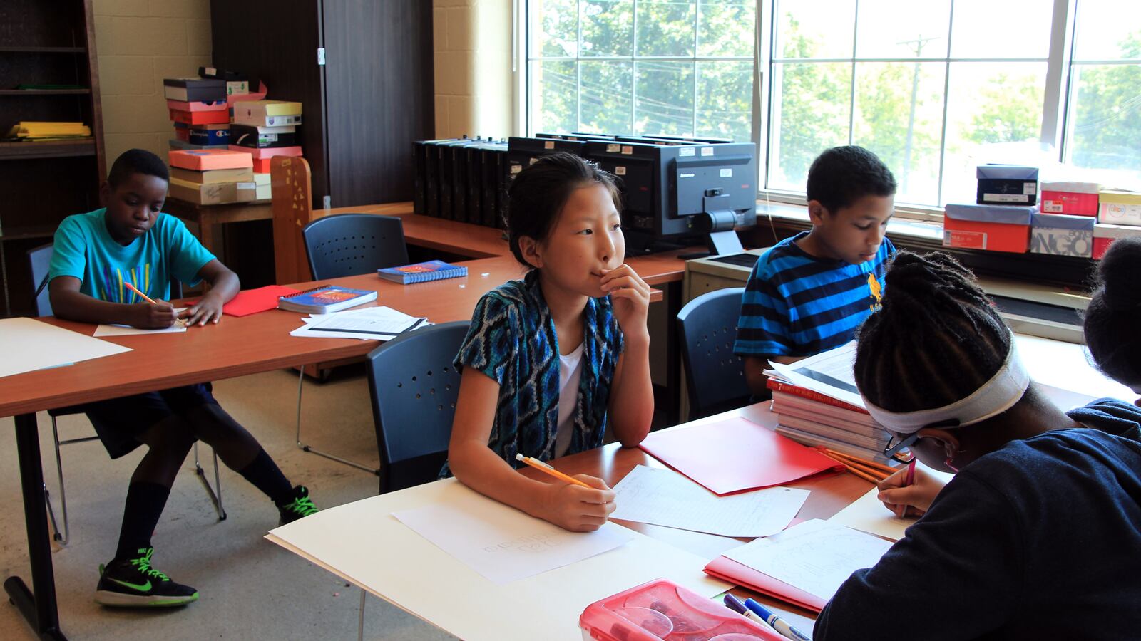 Amanda Zhou, 10, lists characteristics about herself during a self-awareness lesson at the Shelby County Summer Leadership Camp in Memphis.