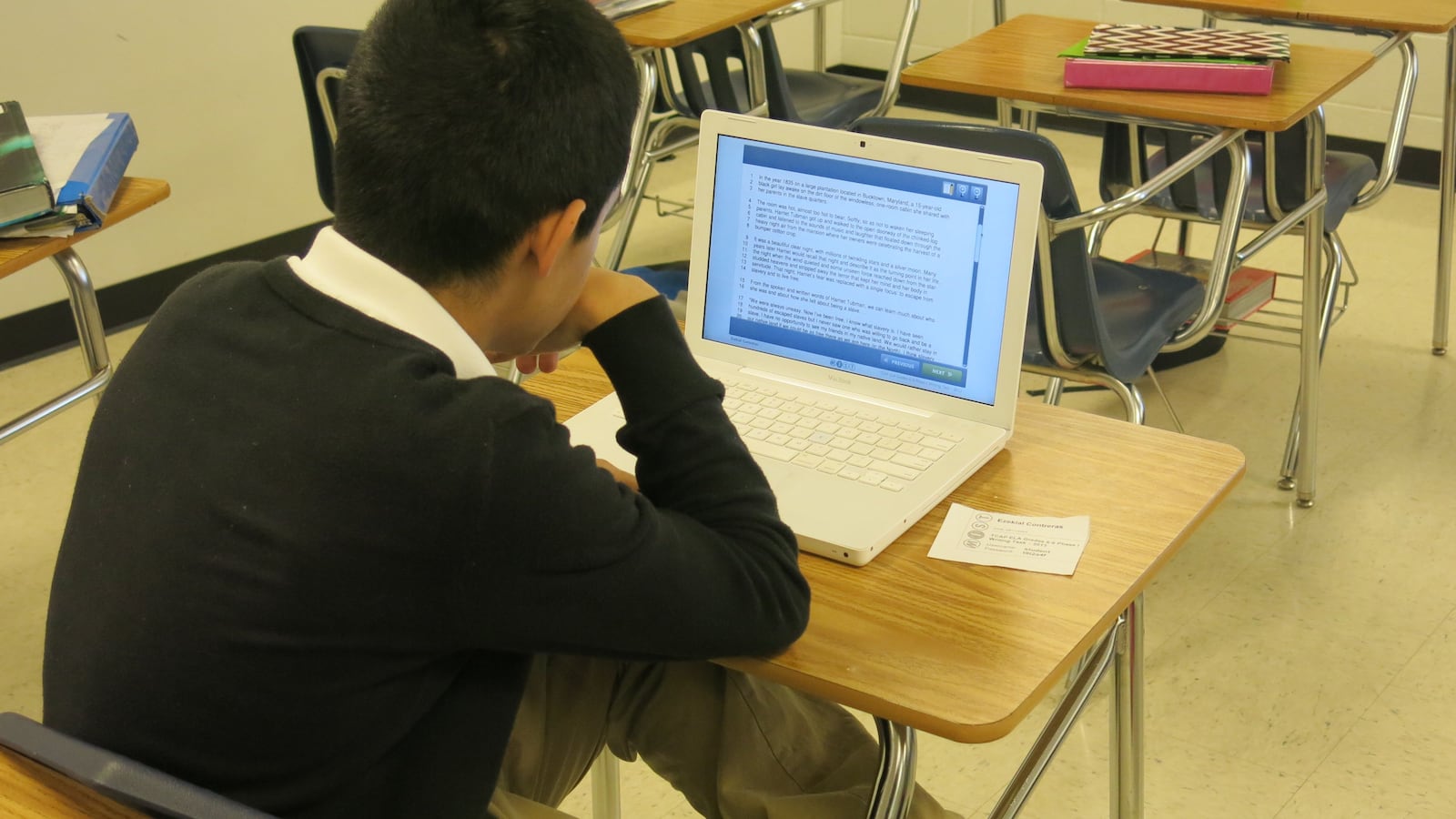 A Colonial Middle School student takes a practice writing test online in January 2014.