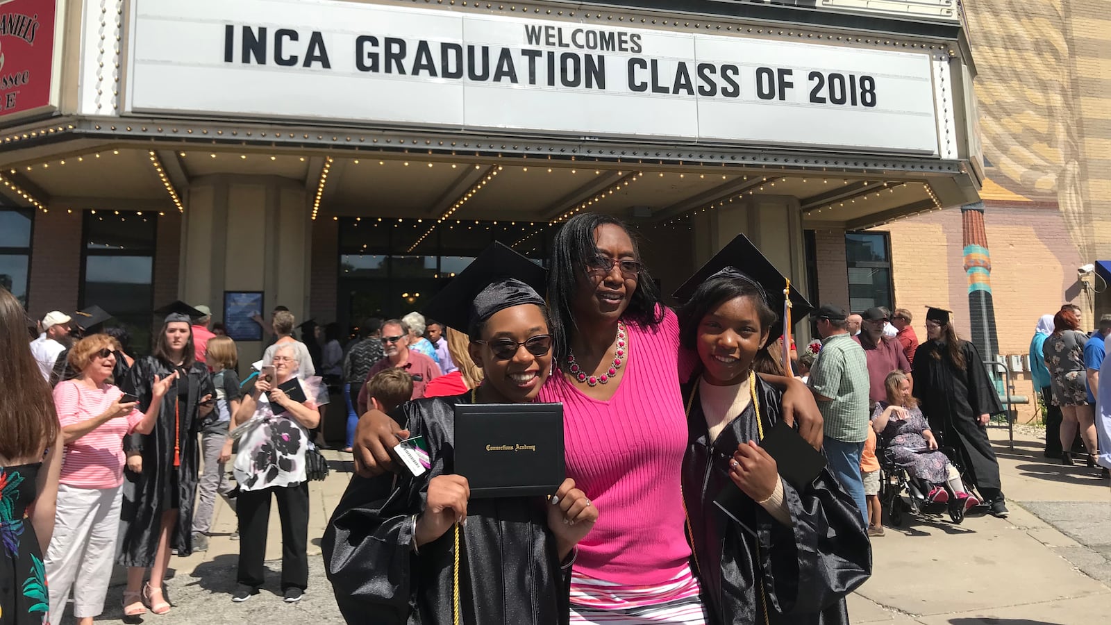 Angela Freel poses with her daughters, Dasani Freel and Cazariah Haskins, outside Old National Center. Dasani Freel and Haskins graduated Monday from Indiana Connections Academy.