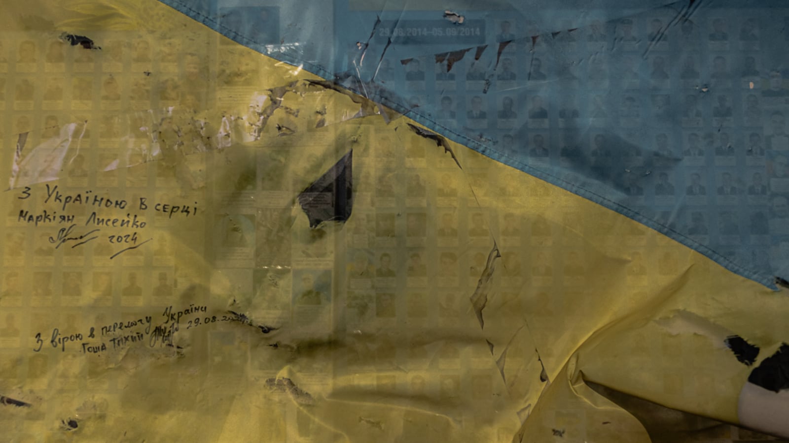 The Ukrainian Wall of Remembrance in Kyiv features the colors of the Ukrainian flag and memorial messages.