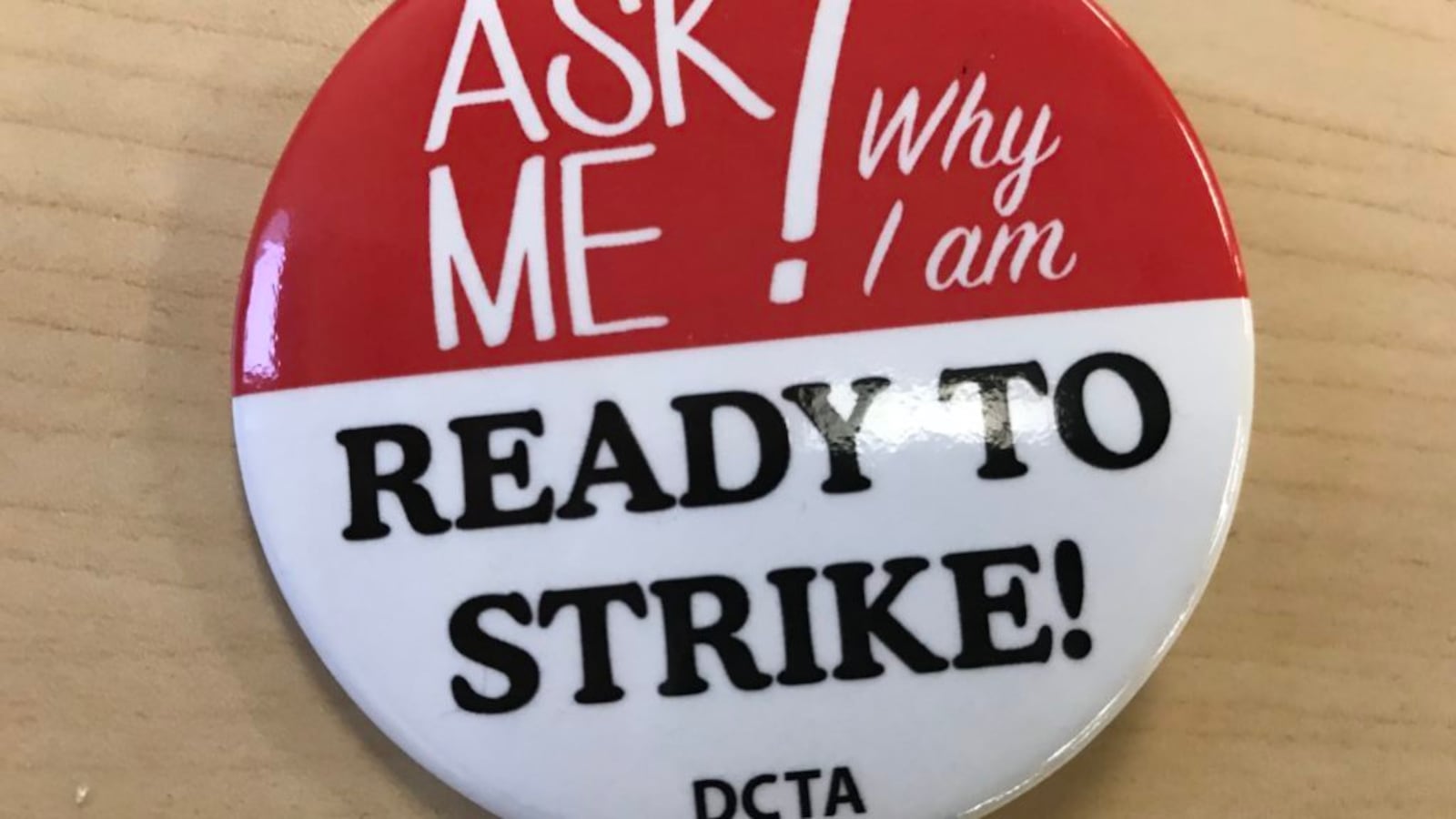 Some Denver teachers are wearing these buttons, provided by the union, at the teacher pay negotiations.