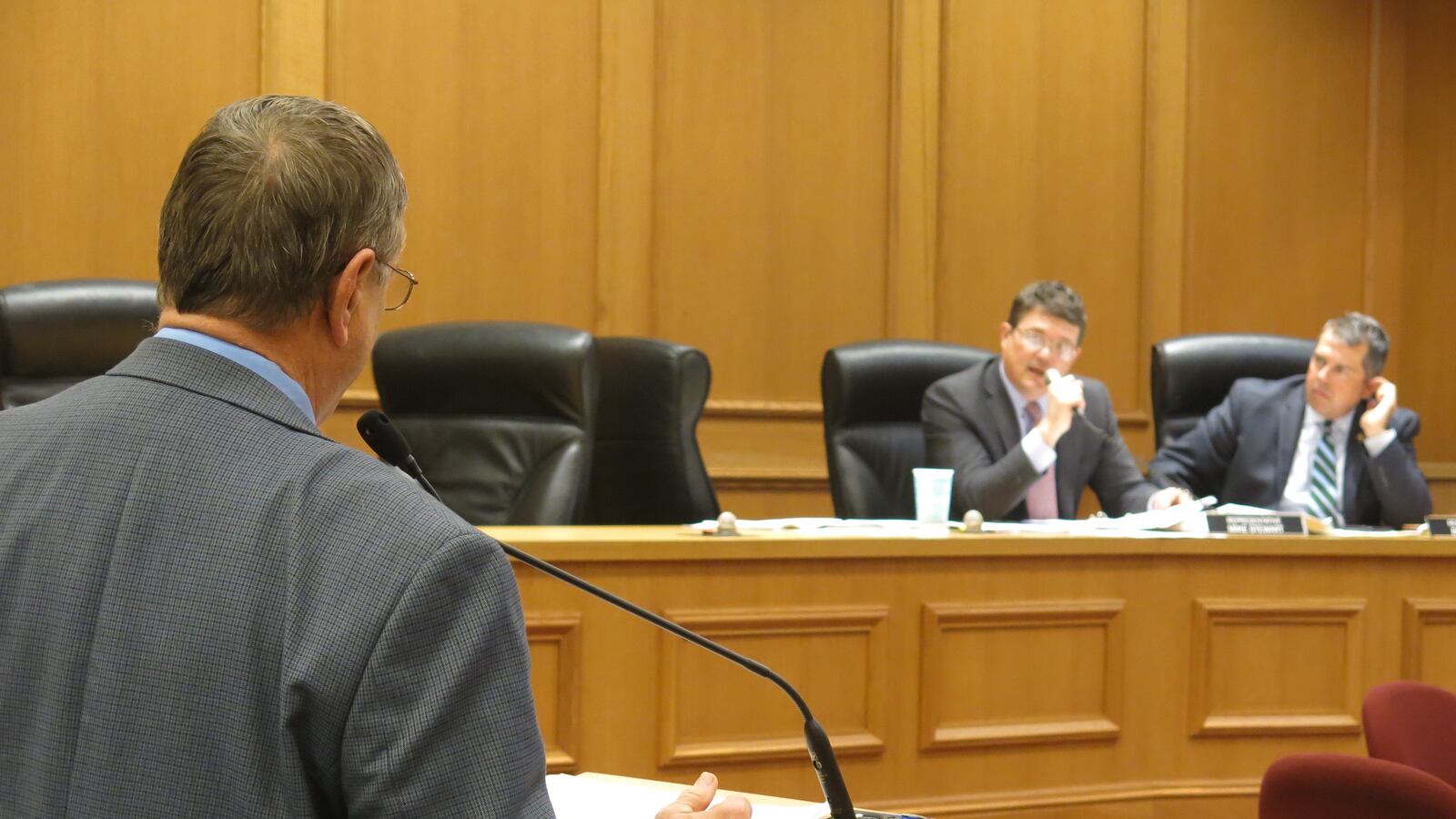 Rep. Harry Brooks, who is sponsoring a bill to pilot school vouchers in Memphis, answers questions from Rep. Mike Stewart during a House committee meeting on March 29.