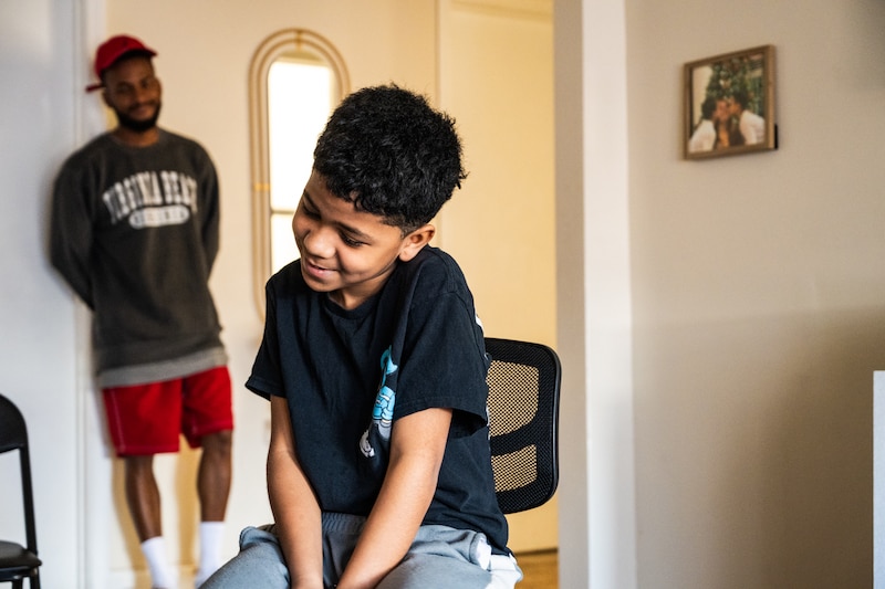Santiago Orozco, 11, sits for an interview at his apartment in South Shore. Santiago attends Ogden International School in the Gold Coast, an hour and a half away from his home. Colin Boyle/Block Club Chicago