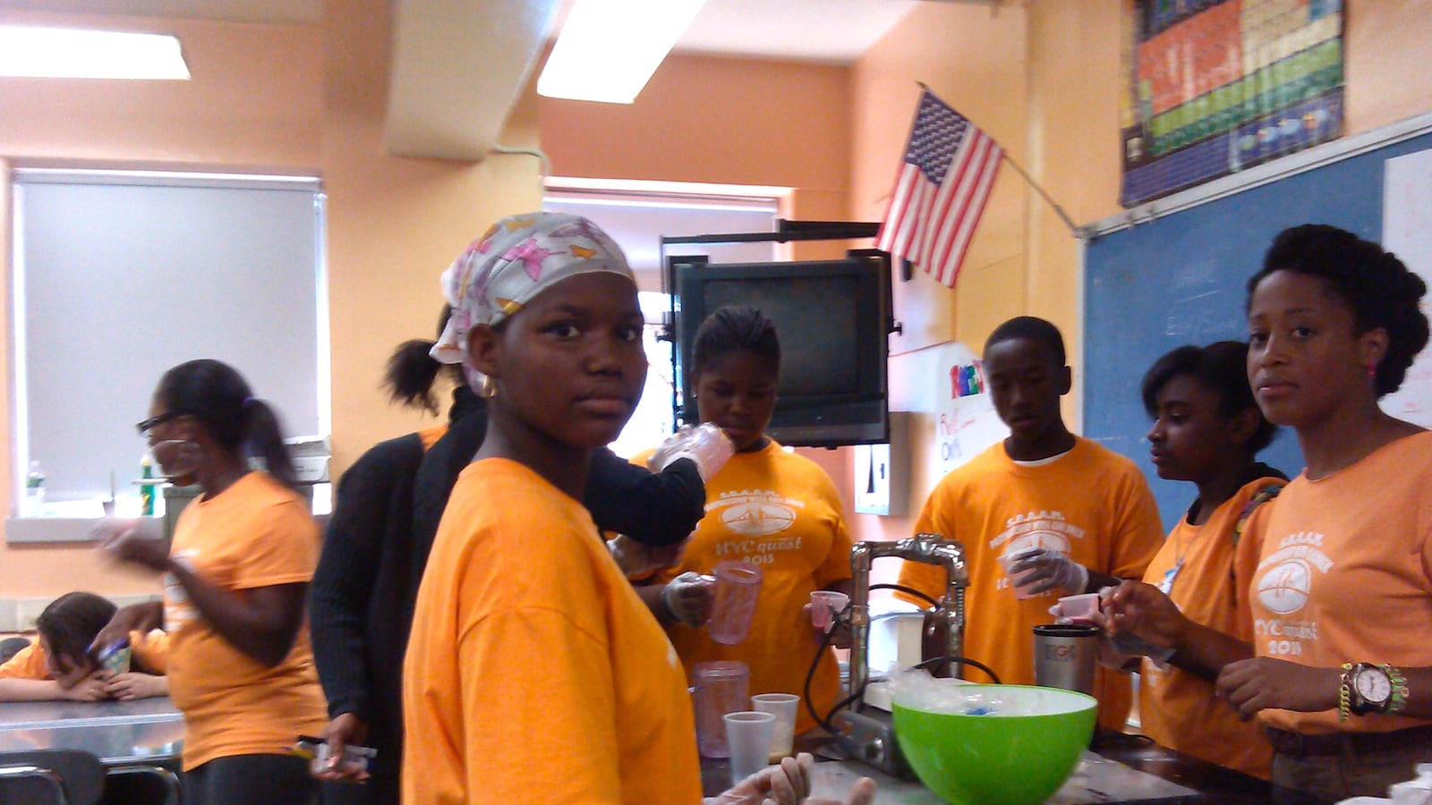 Jennifer Rosario (right), a social worker with Partnership with Children, teaches students from the South Bronx Academy for Applied Media to make smoothies during last year's Summer Quest program.