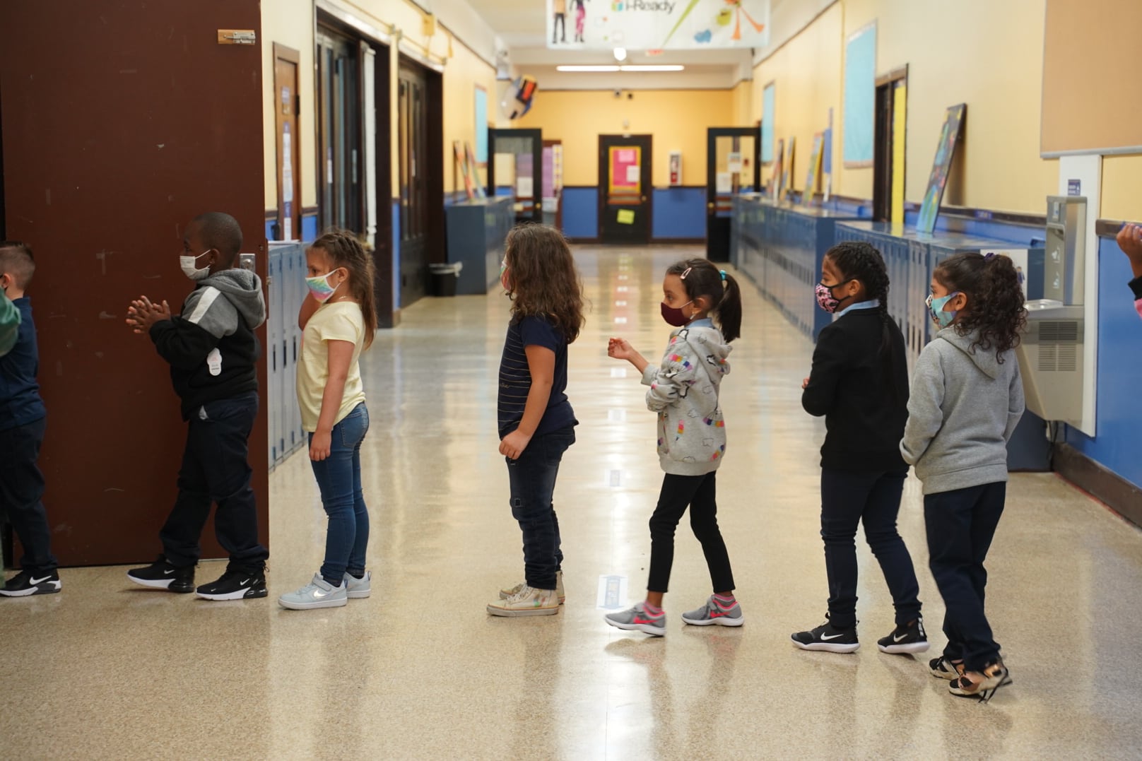 Students at a Detroit elementary school line up as they walk through the hallways.