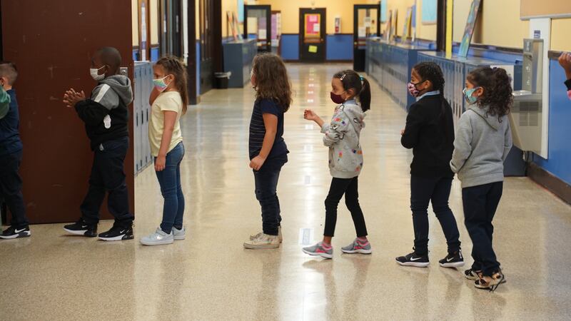 Students at a Detroit elementary school line up as they walk through the hallways.
