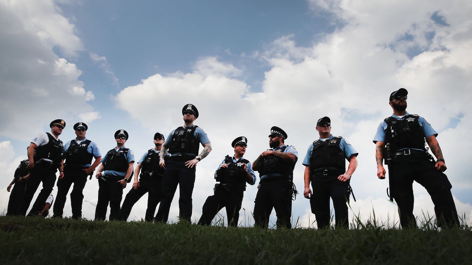 Police officers stand alongside Lake Shore Drive in August as protesters decry violence and lack of investment in African-American neighborhoods and schools