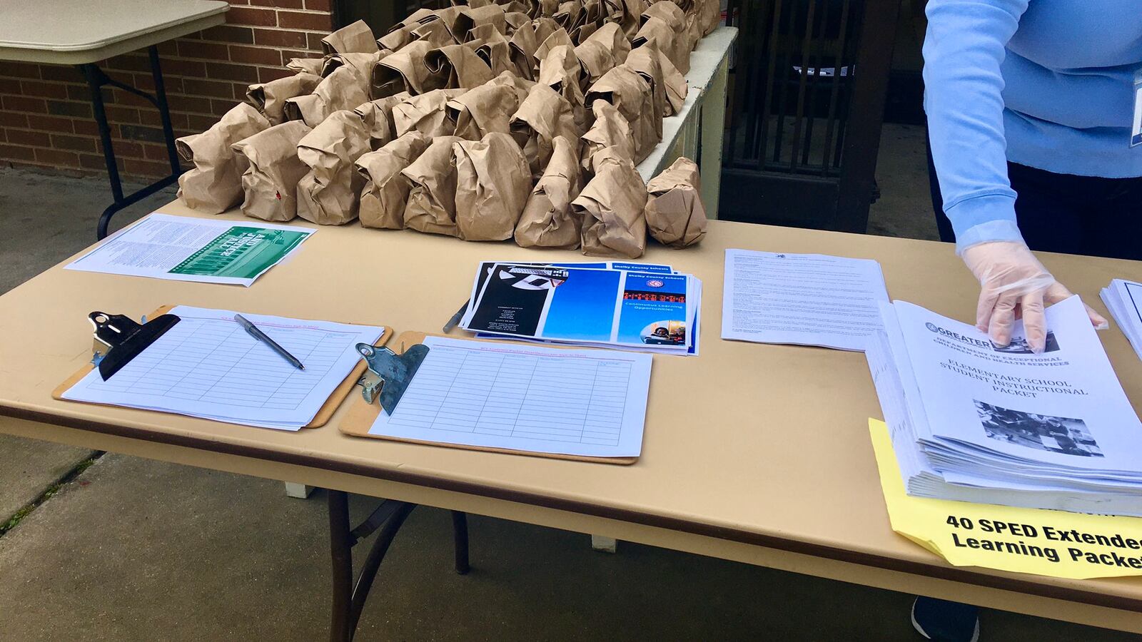The YMCA took over food distribution for students as district staff prepared paper learning packets for pickup.