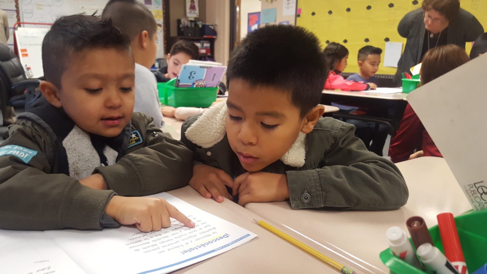 First grade students practice reading in Spanish in their biliteracy classroom at Dupont Elementary School in Adams 14.