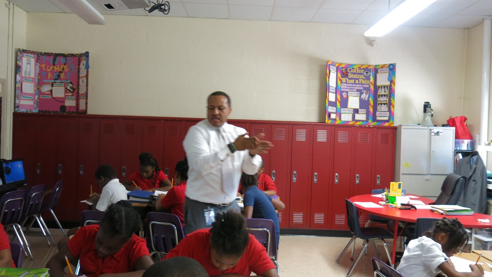 Cherokee teacher Roland Woodson gives a lesson about plate tectonics on Tuesday.  The iZone school has made large gains and is off the state's Priority List and is now earned Reward status.