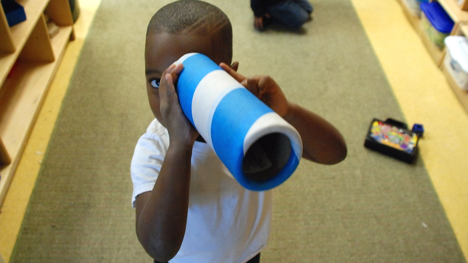 A preschooler at Clayton Early Learning created a makeshift telescope this fall.