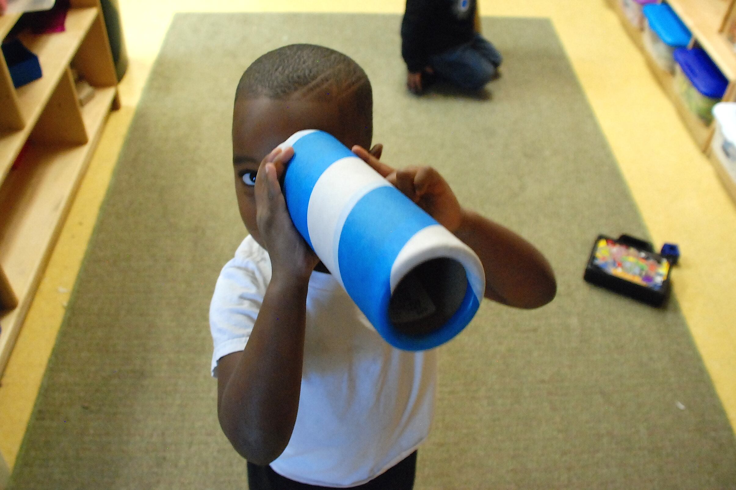 A preschooler at Clayton Early Learning created a makeshift telescope this fall.
