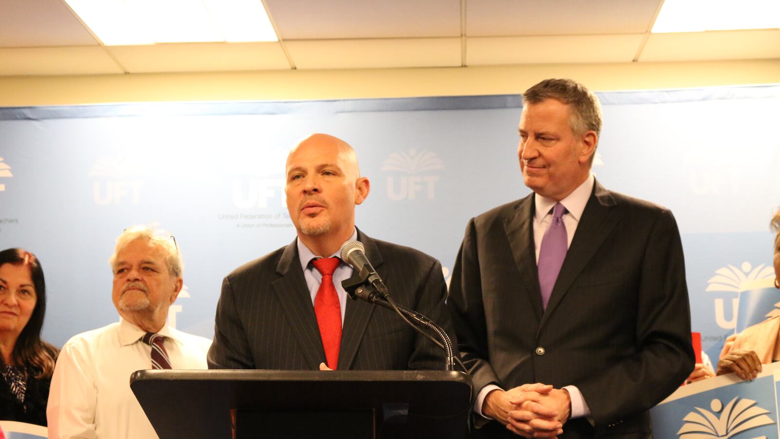 United Federation of Teachers President Michael Mulgrew, center, and Mayor Bill de Blasio