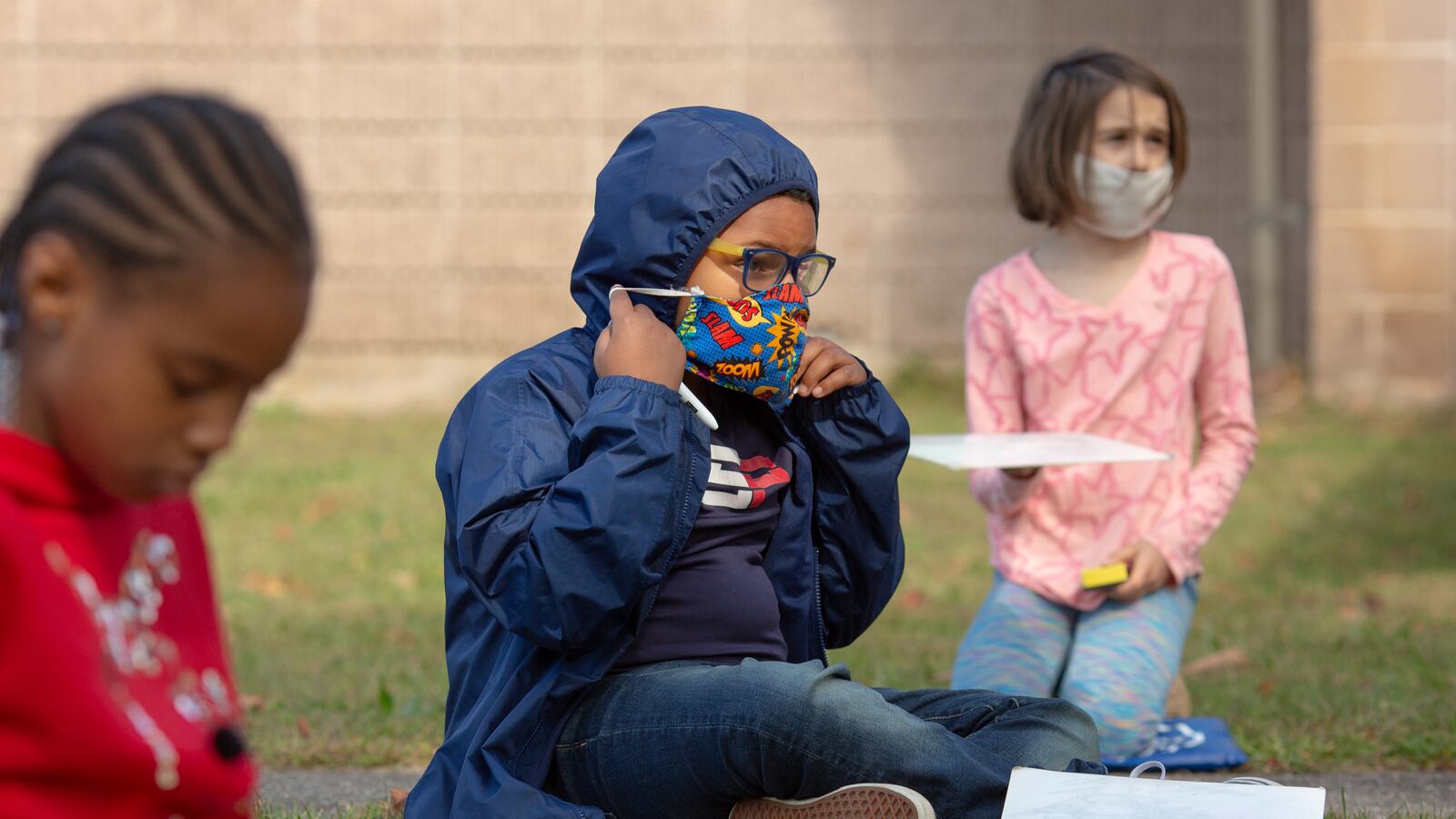 Students wearing masks in an outdoor class.