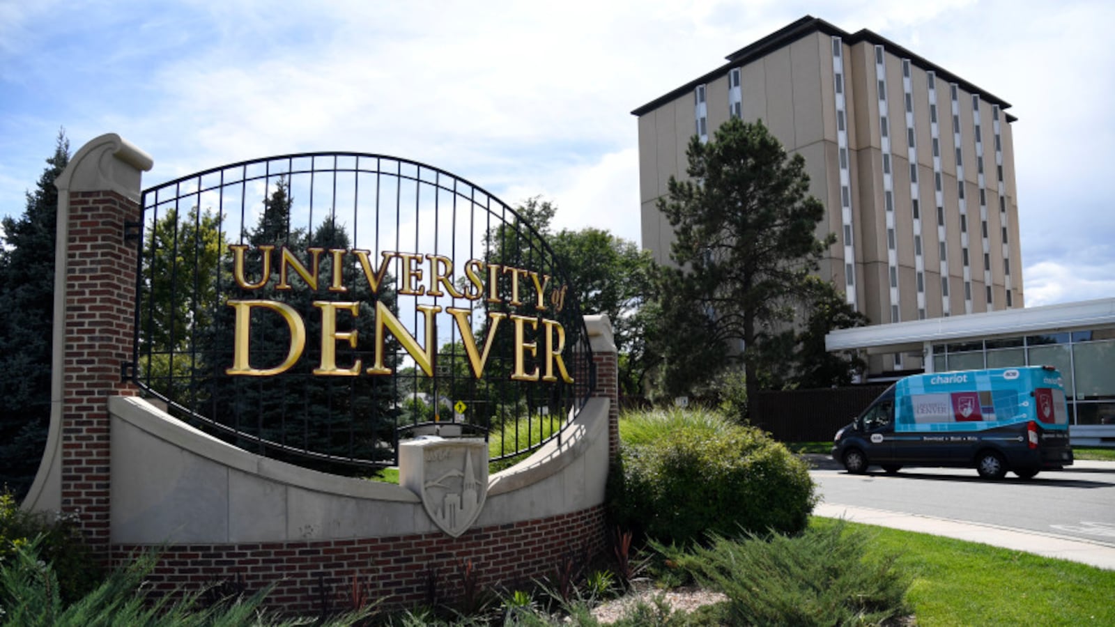 Sign depicts an entrance to the University of Denver campus.