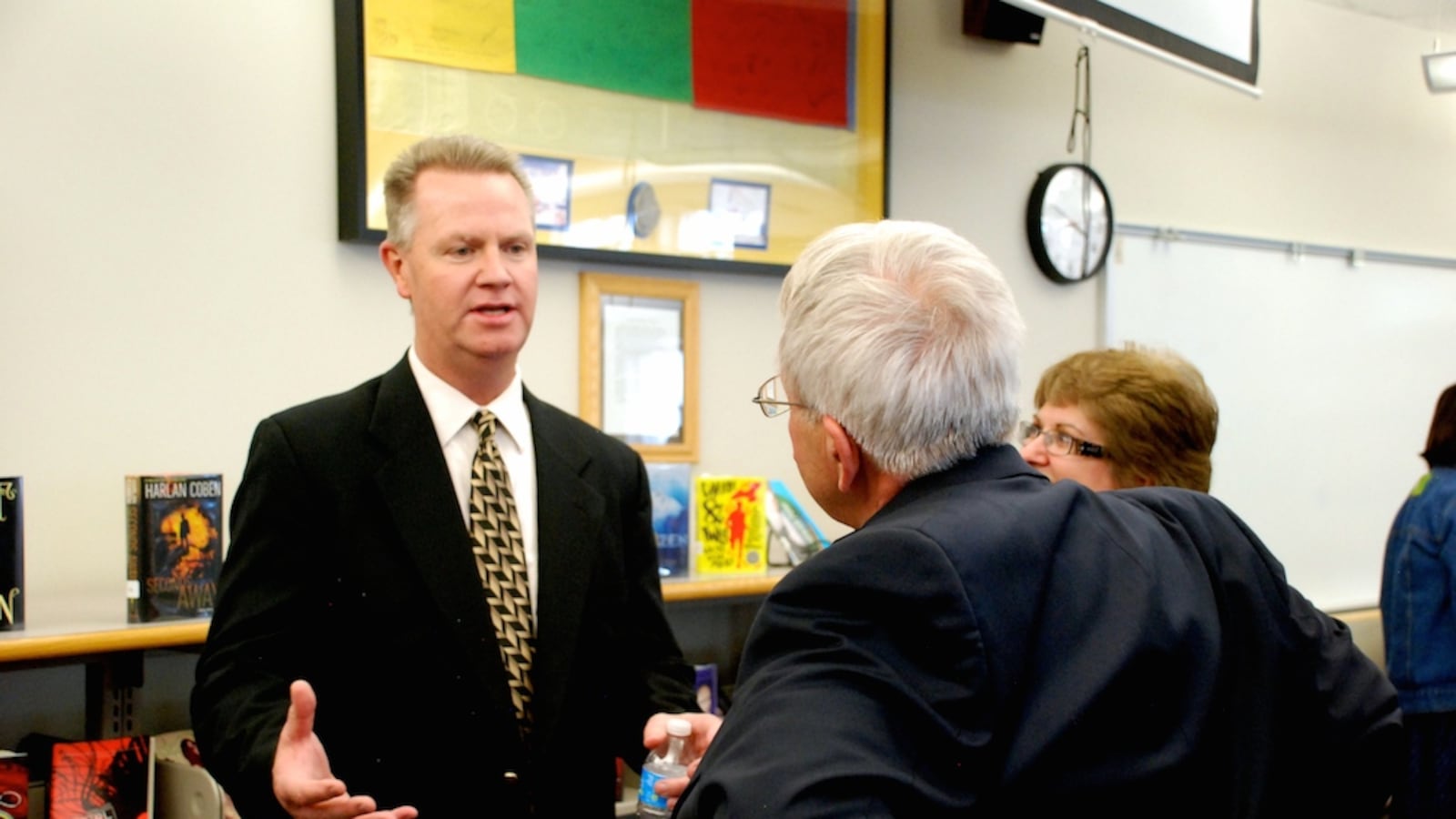 Dan McMinimee, left, meets with members of the Jefferson County community May 15. McMinimee, a Dougco administrator, is the sole finalist to become superintendent of Jeffco Public Schools.