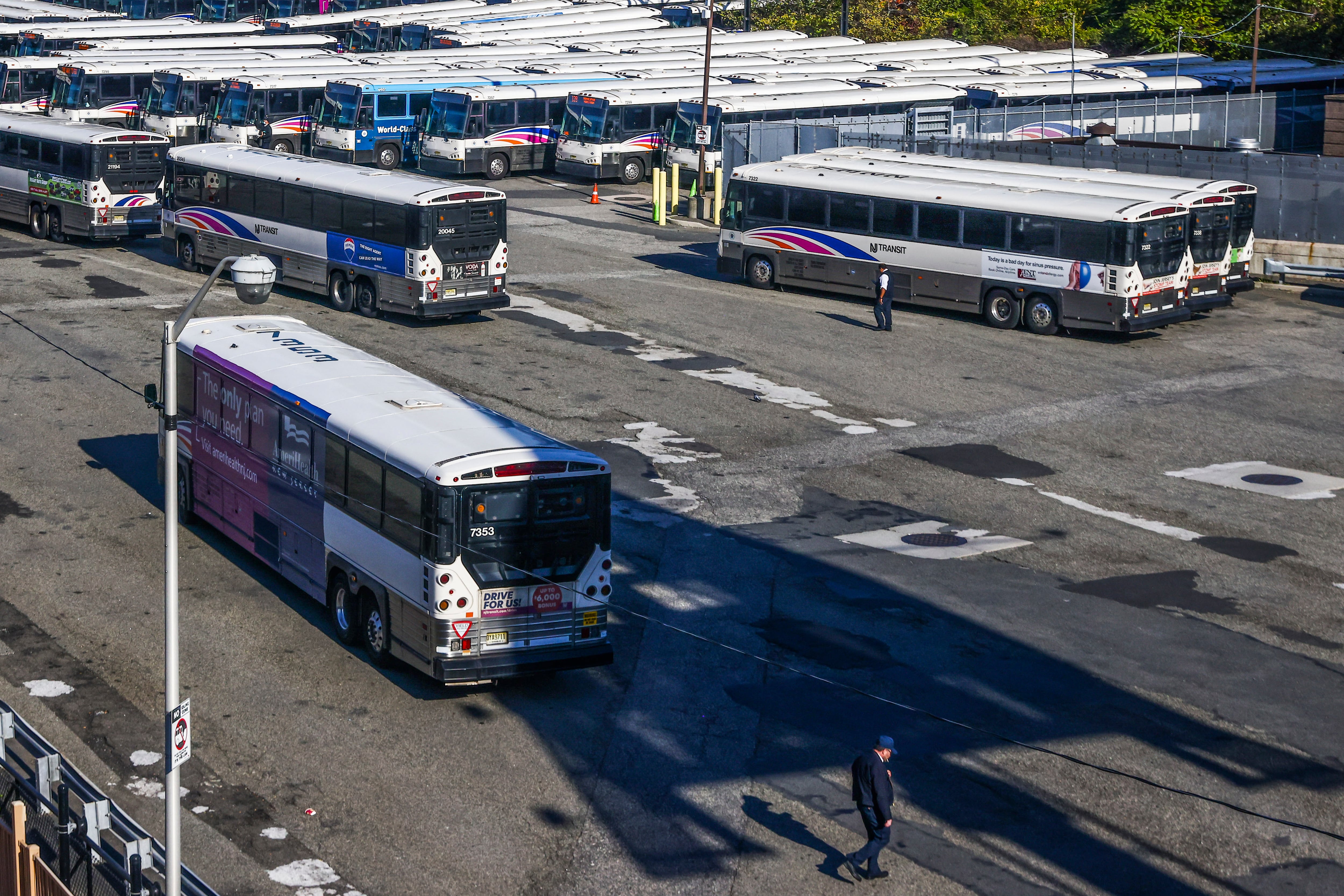 Busses are parked inside a bus station in Jersey City, New Jersey, 