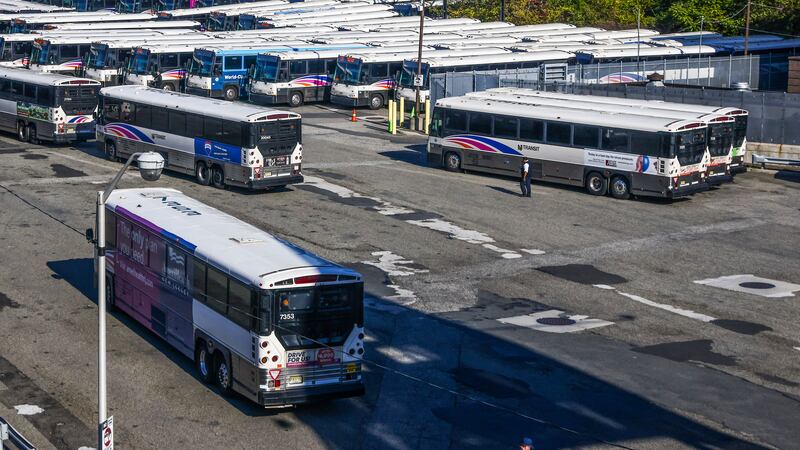 Busses are parked inside a bus station in Jersey City, New Jersey, 