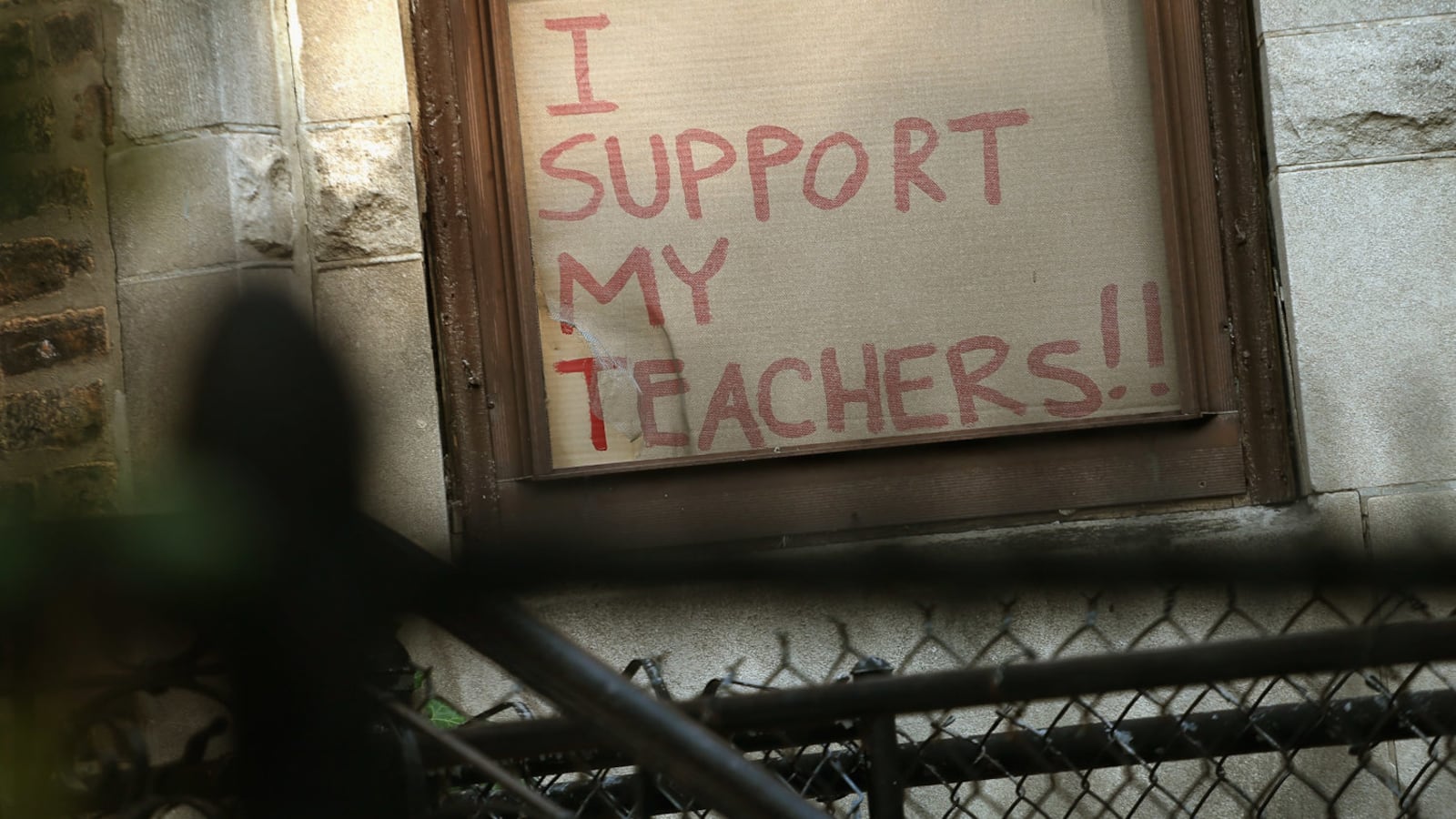 From a previous strike: A sign supporting teachers sits in the window of a home during the 2012 teacher strike