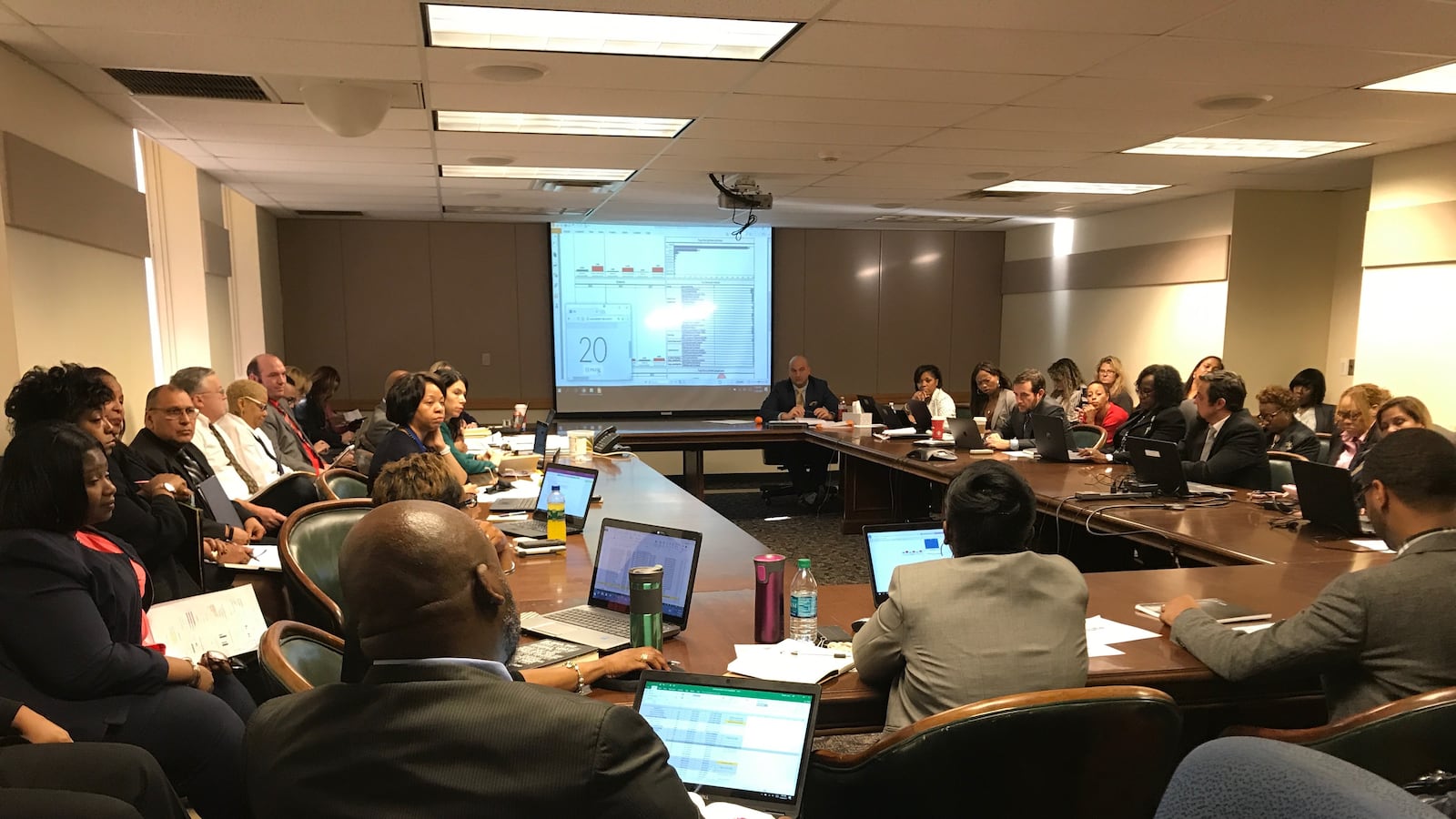 Detroit Schools Superintendent Nikolai Vitti (center) has been summoning district principals to discuss their schools at "data chats" attended by their colleagues and bosses. "This is the work," Vitti said. “You’re constantly problem solving. You're surfacing issues … and you’re looking at data to make decisions.”