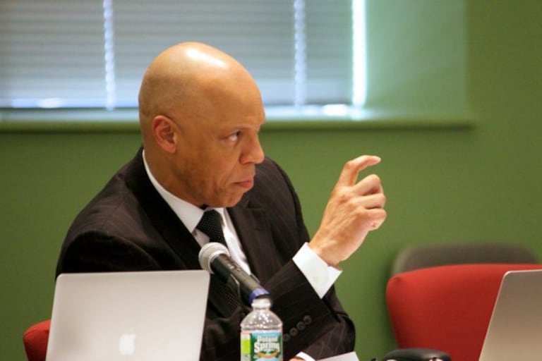 Philadelphia Superintendent William Hite looks forward while speaking at a desk with a laptop in front of him.