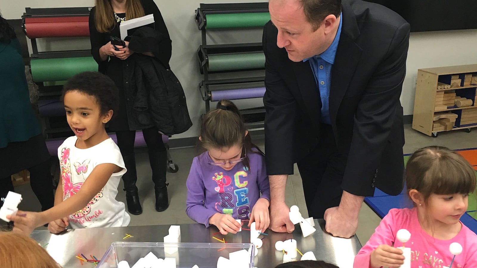 Colorado Gov. Jared Polis visits with preschoolers at the Maddox early childhood center in the Englewood school district in early 2019.