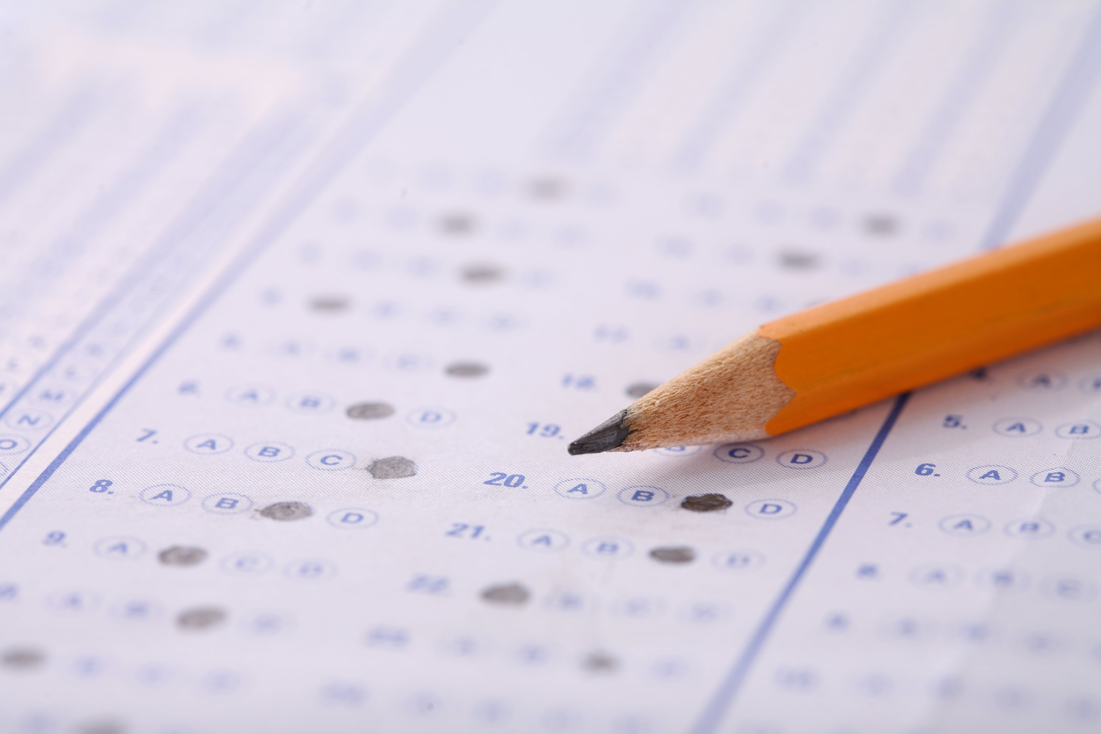 A pencil rests on an out-of-focus test