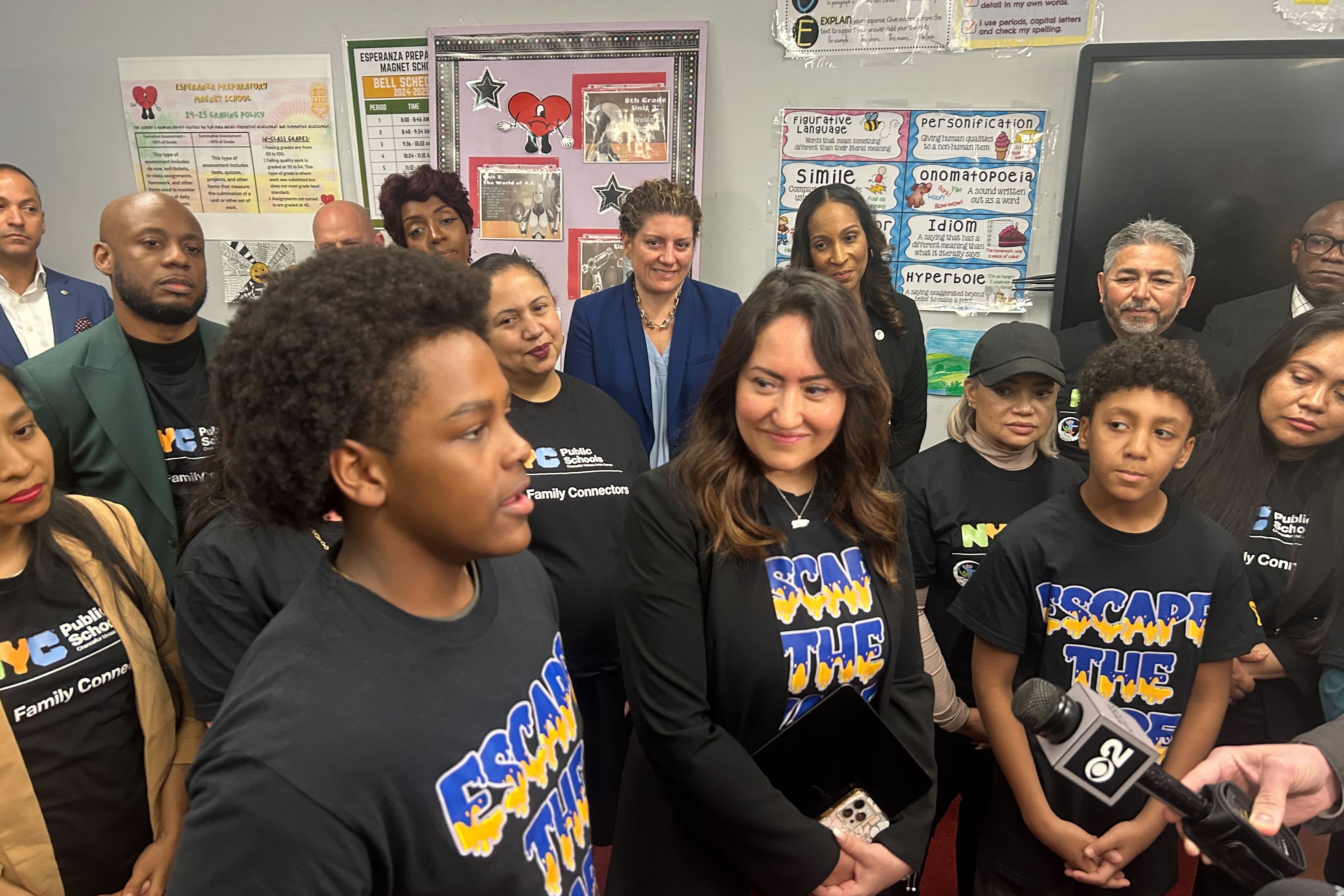 A group of kids and adults wear T-shirts saying, "Escape the vape."