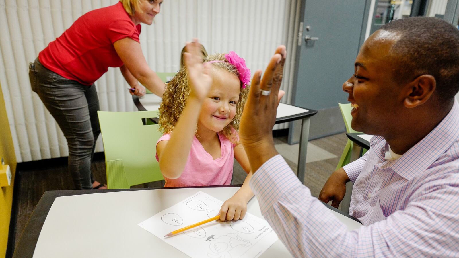 Tay Anderson gives a high-five.