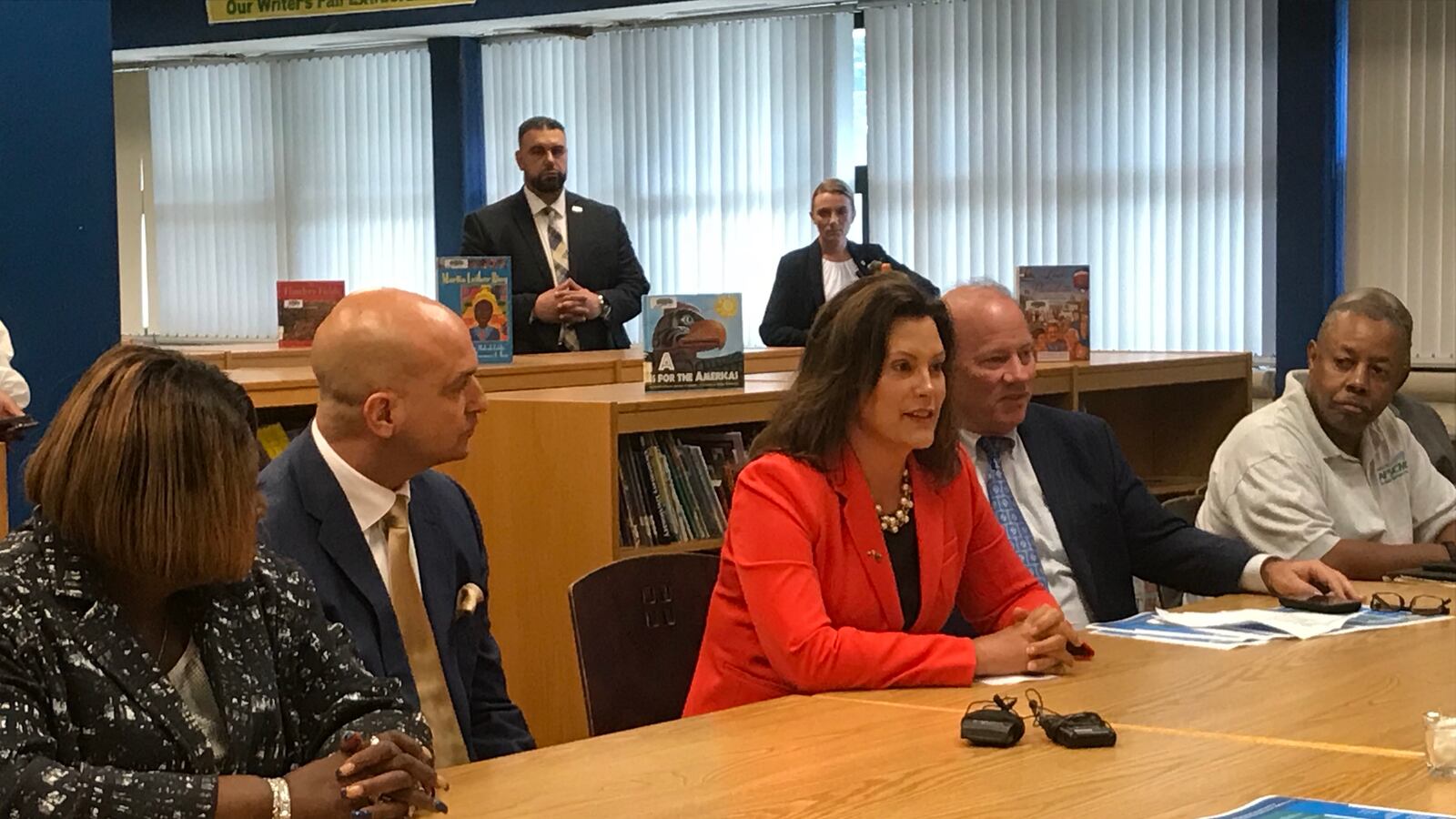 Michigan Gov. Gretchen Whitmer is flanked by Detroit Superintendent Nikolai Vitti, left, and Detroit Mayor Mike Duggan, right, as she makes the case for her K-12 budget recommendations during an event Tuesday at Charles H. Wright Academy of Arts and Sciences.