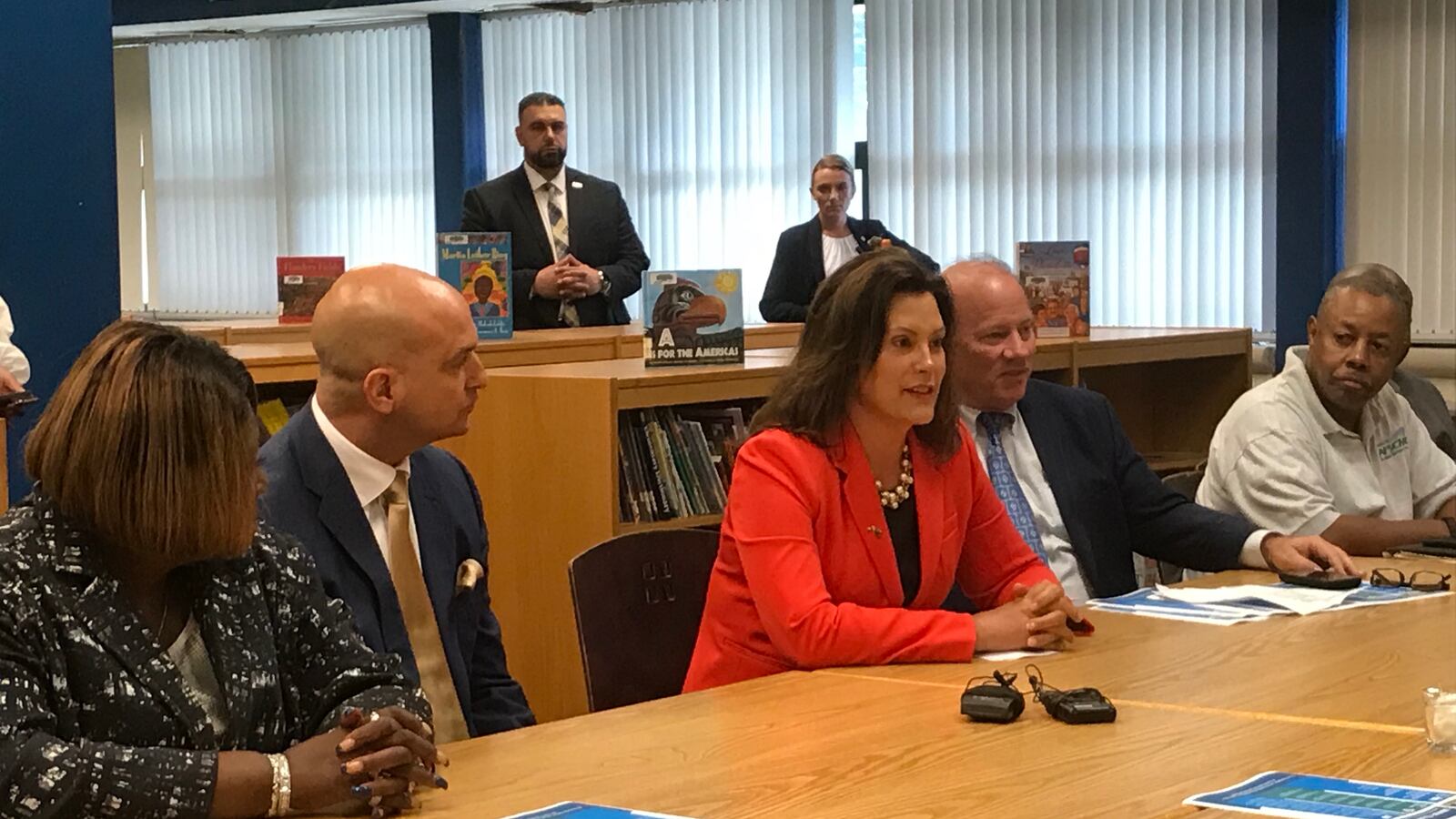Michigan Gov. Gretchen Whitmer is flanked by Detroit Superintendent Nikolai Vitti, left, and Detroit Mayor Mike Duggan, right, as she makes the case for her K-12 budget recommendations during an event Tuesday at Charles H. Wright Academy of Arts and Sciences.