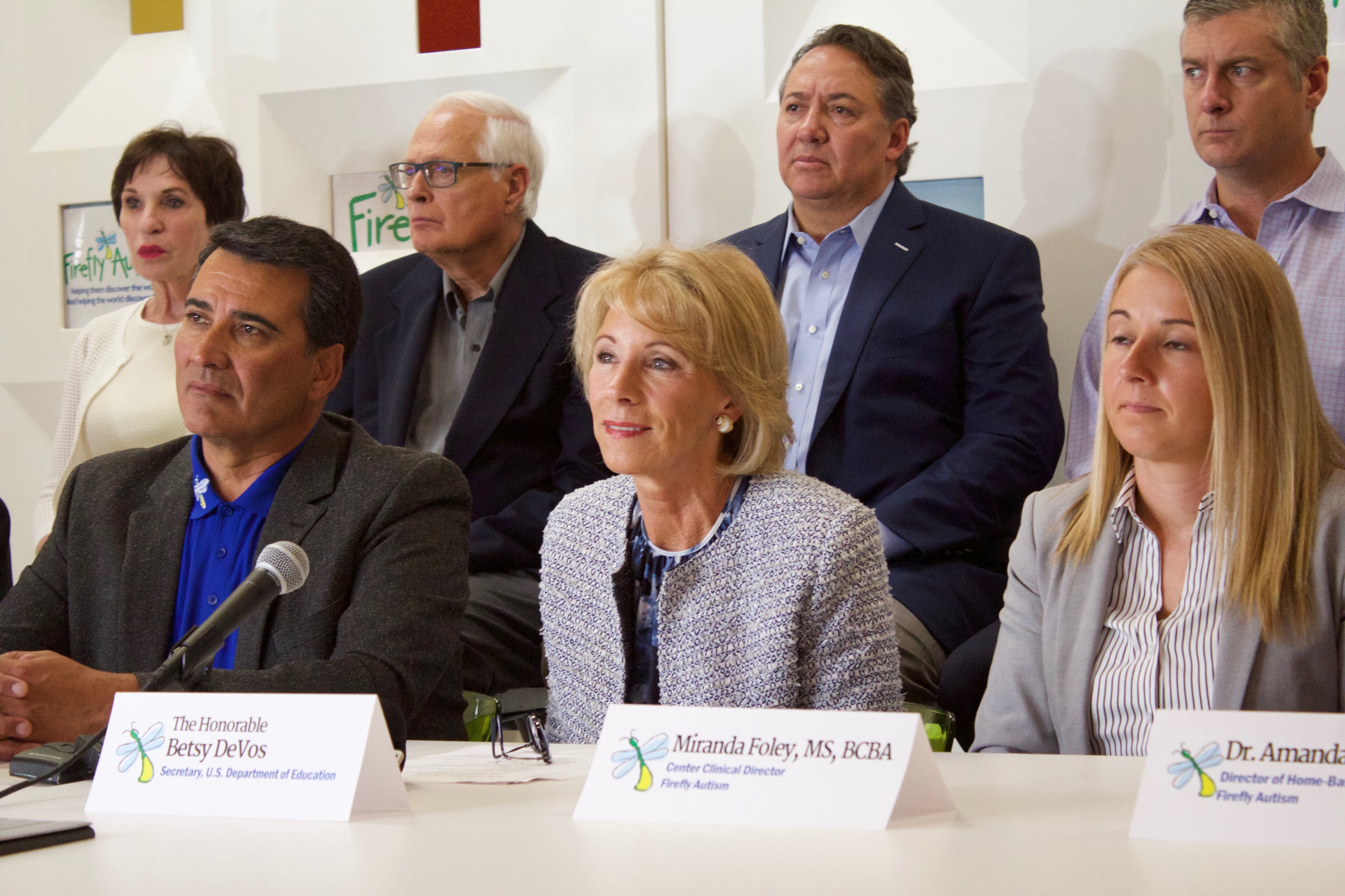 Betsy DeVos, center, at Denver's Firefly Autism House.