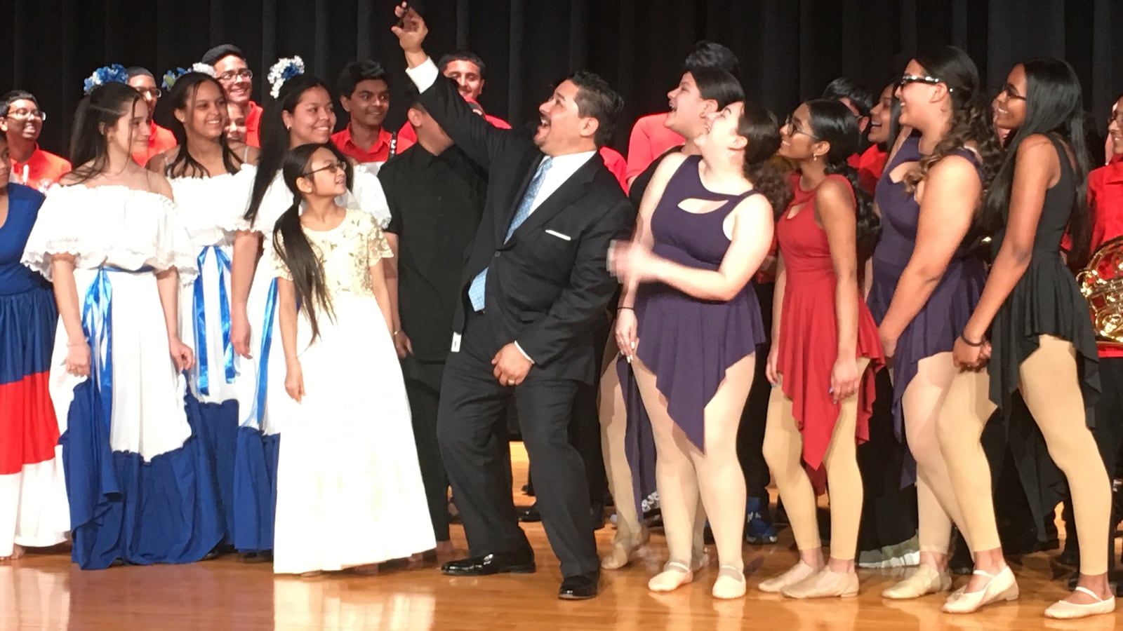 Chancellor Carranza takes a selfie with students from MS 137 America's School of Heroes.