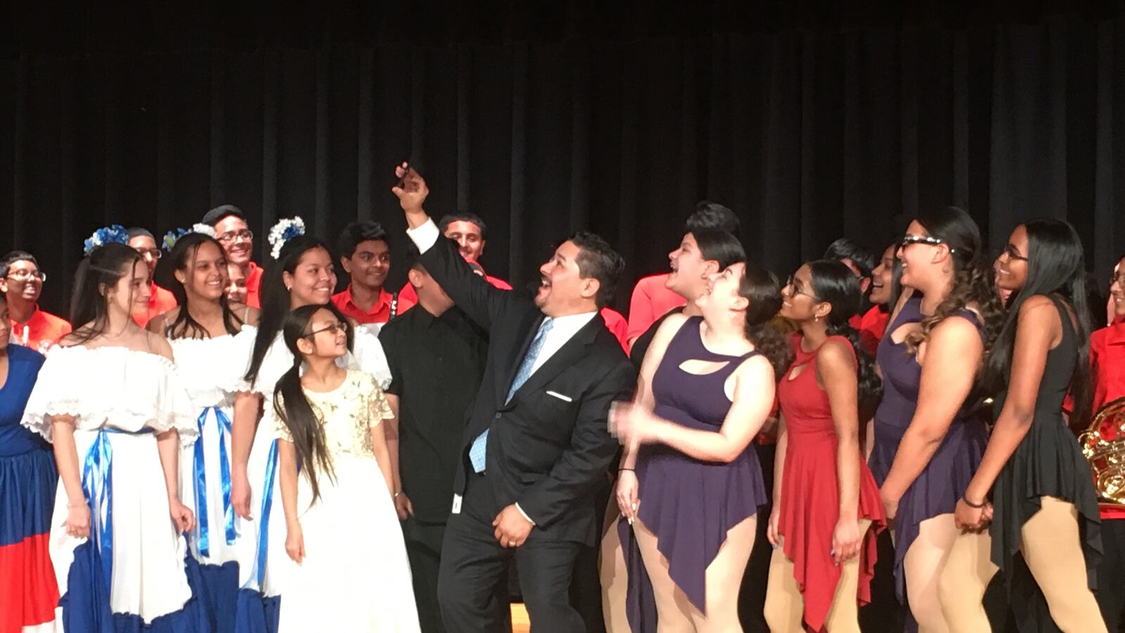 Chancellor Carranza takes a selfie with students from MS 137 America's School of Heroes.