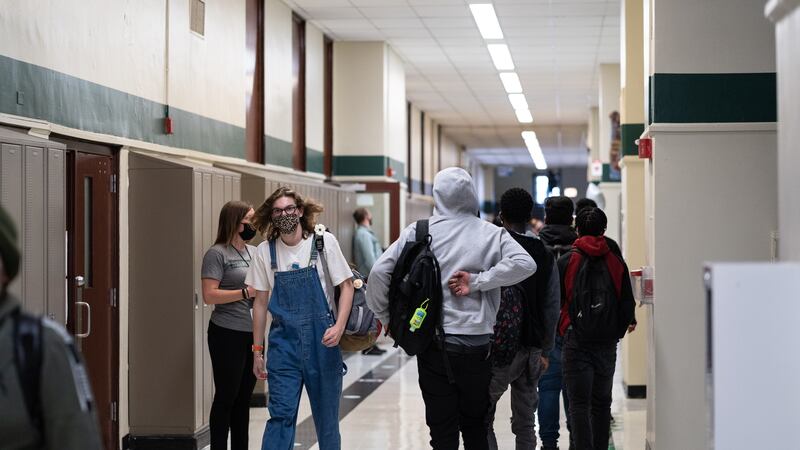 Students walk the halls of Senn High School on the first week back to classrooms on April 23, 2021.