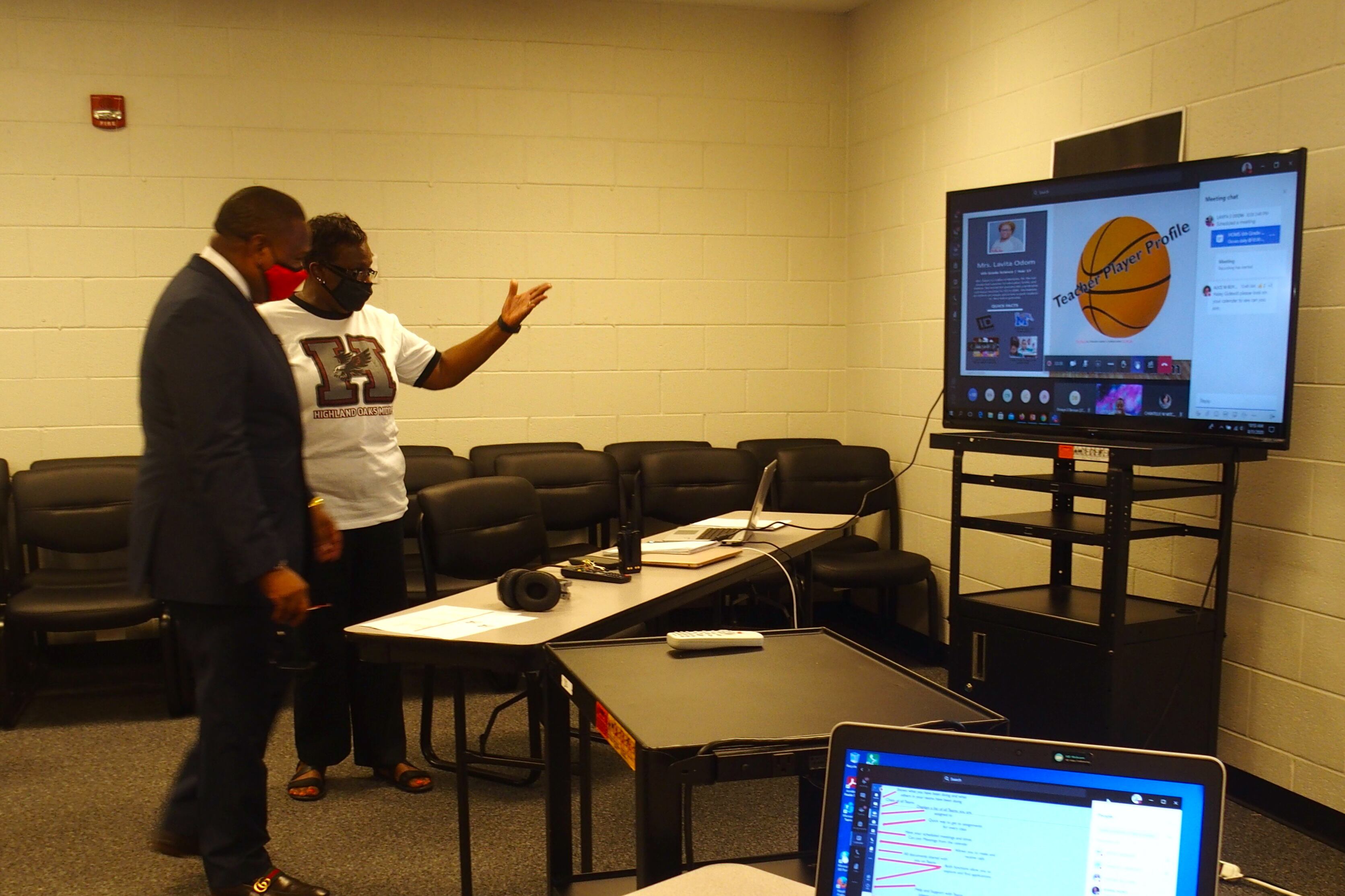 An educator explains how she monitors online classes with large screens