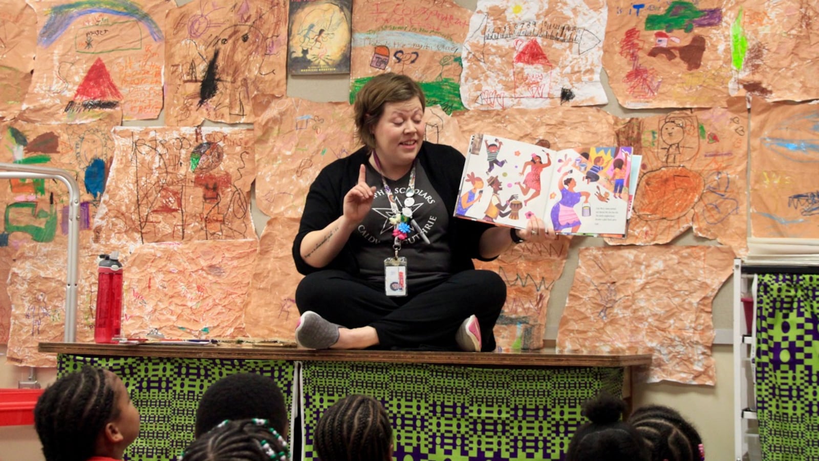 With the help of a picture book, Anna Barton Schnadelbach discusses murals with her students at Memphis Scholars Caldwell-Guthrie Elementary School.