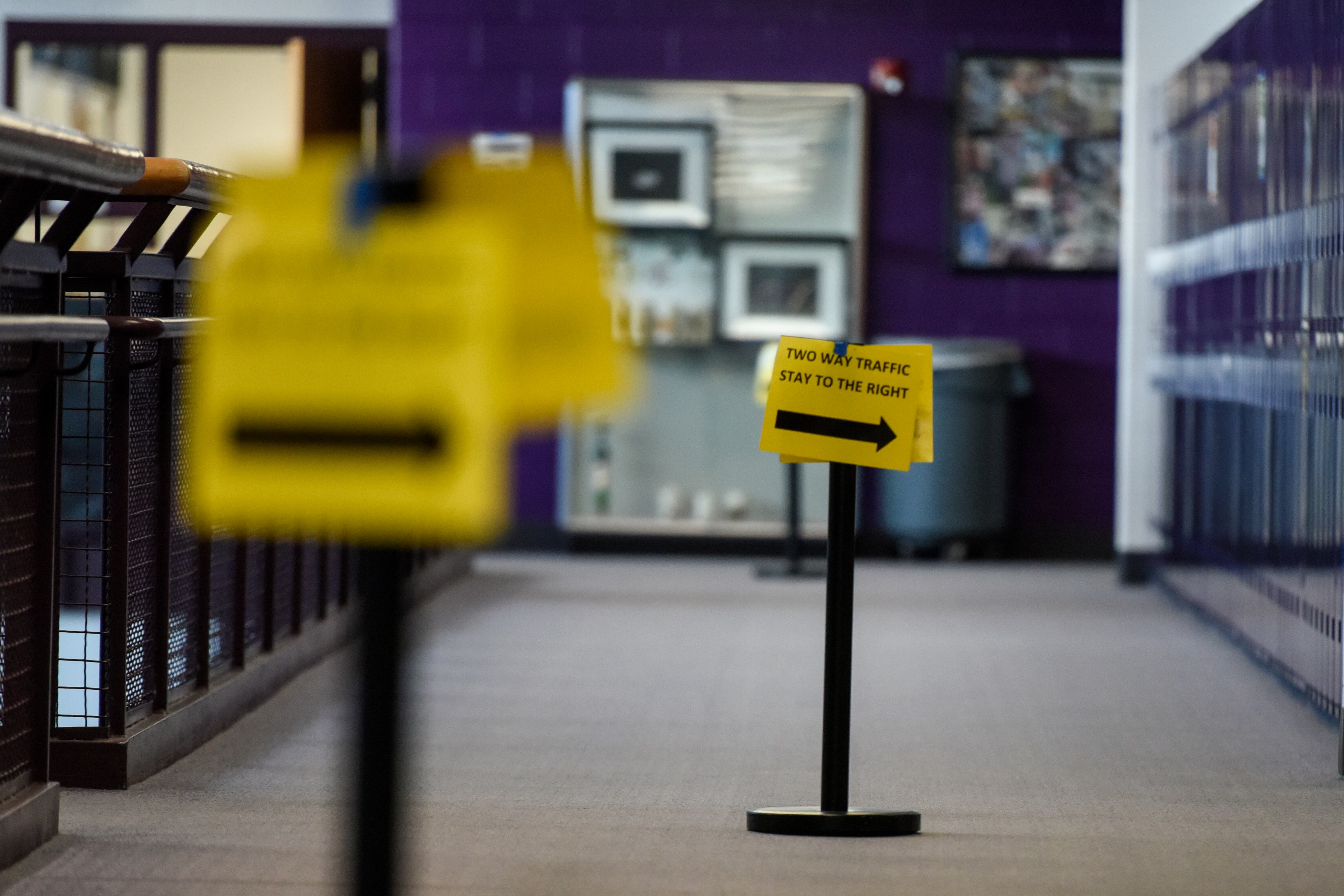 Sign in a school hallway asks people to stay to the right as a COVID precaution.