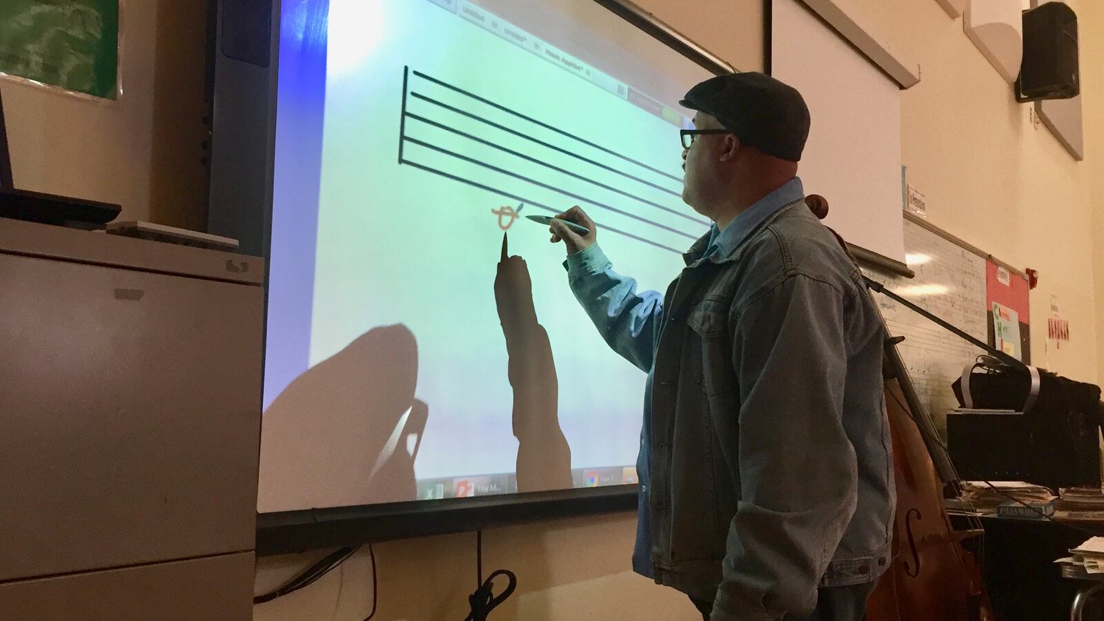 Music teacher Quincy Stewart incorporates math, writing and history in his music classes at Detroit’s Central High School