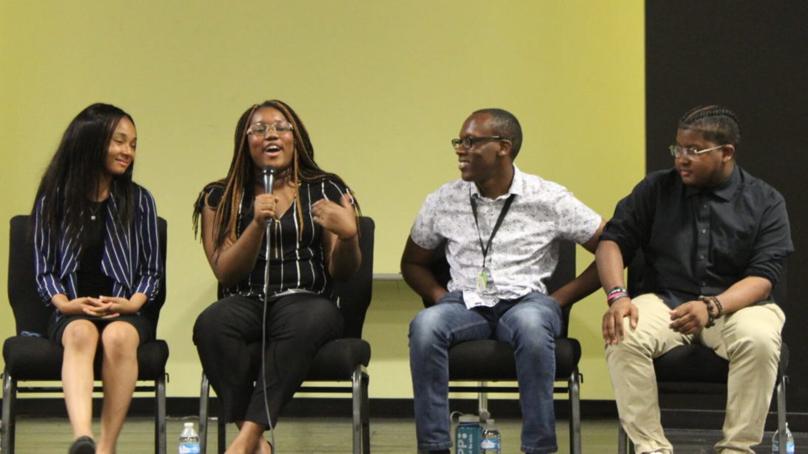 Freedom Prep student Destiny Dangerfield talks alongside Asiah Hayes, Detario Yancey, and Evan Walsh at a panel discussion for TFA Memphis trainees.